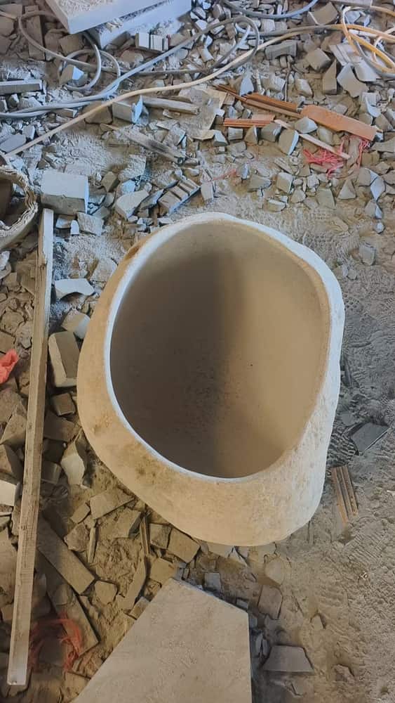 Tall oval stone pedestal wash basin photographed from above