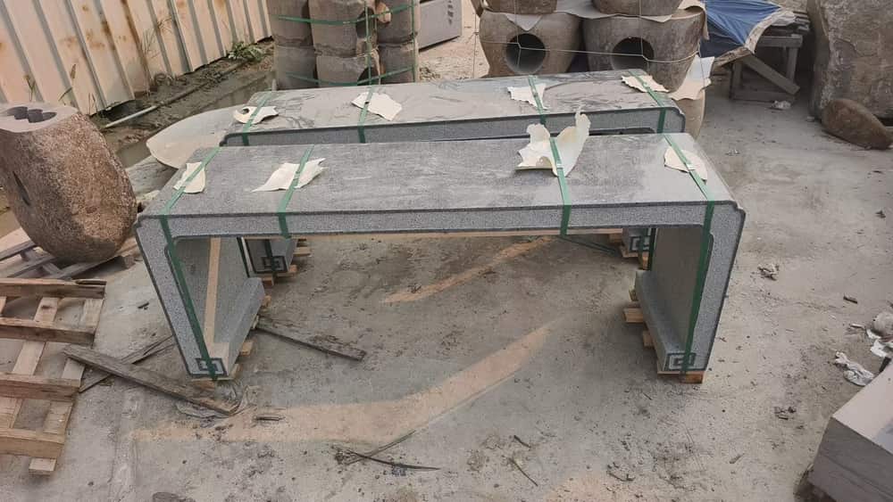 Natural stone bench slab showing the surface and edge during workshop preparation