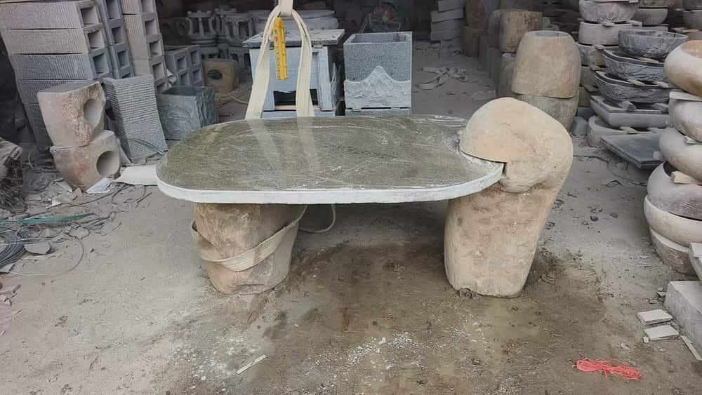 Rectangular stone table with cylindrical stools